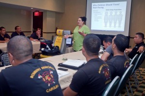 Irene Rodriguez teaching a child safety seat class.