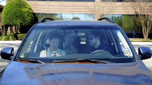 Passengers inside a vehicle using the Carma carpooling smartphone app.