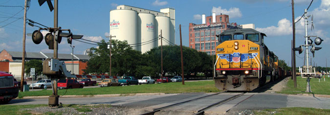 train nearing a railroad crossing in Sugar Land, Texas